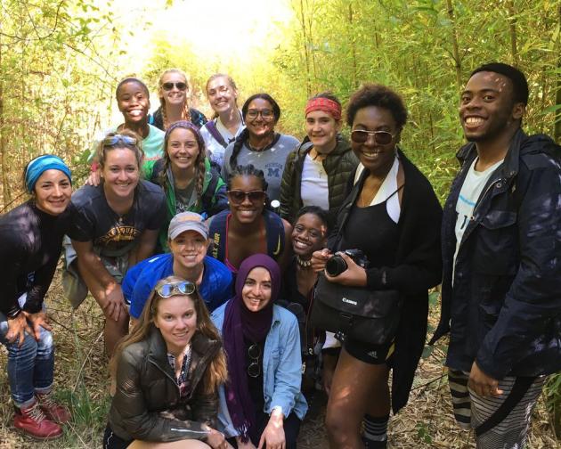 a group of student pose for a photo in the forest in Cape Town