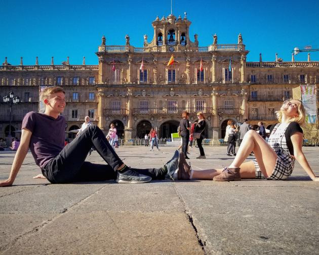 students posing for a fun photo in front of Plaza Mayor in Salamanca