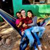 three students pose for a photo in a hammock in San Pedro de Atacama, Chile