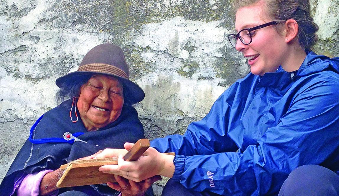 Student talking to an older woman who is local to Quito