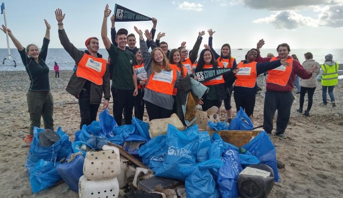 Group of students cleaning up a beach in Dublin