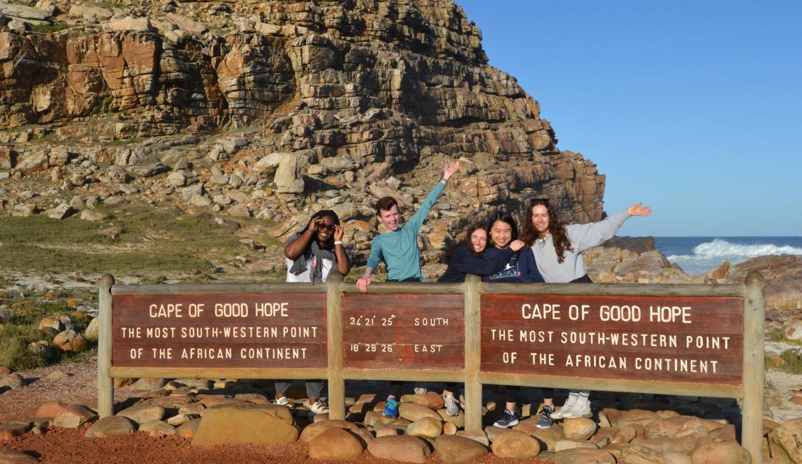 a group of students pose for a fun photo at Cape of Good Hope