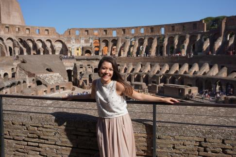 Student happily posing in the Roman Colosseum