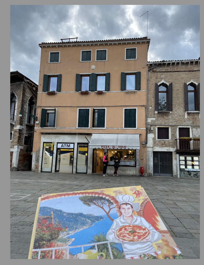 pizza box in front of building