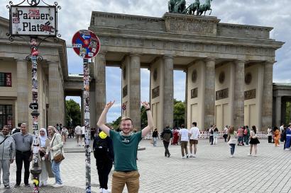 Me standing next to the Brandenburg Gate