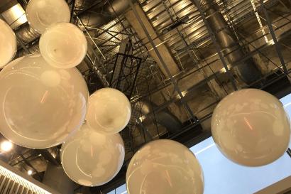 Picture shows tan plastic bubbles attach to the ceiling 