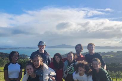 A panoramic picture of several members of IES Auckland on Waiheke Island.