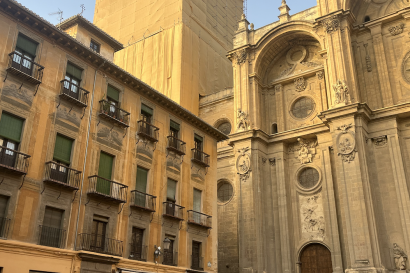 People walking in front of the cathedral in Granada. 