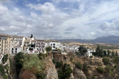 View from a lookout point of buildings and rocks in Ronda, Spain. 