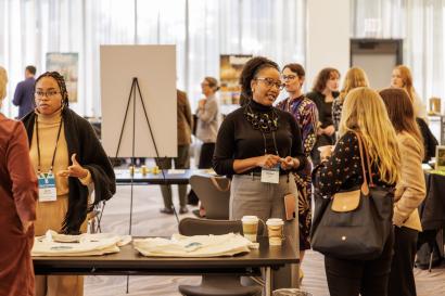 Colleagues engaging in conversation at Center Expo