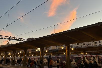 The sun setting behind the Rome metro station. 