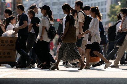 Group of people crossing a street during the day