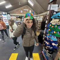Me putting on a goofy hat my friends and I found at the Blue Mountains' gift shop.