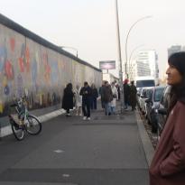 My roommate looking at the Berlin Wall