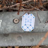 metal railing with white sticker on top 