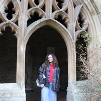 Photo of me standing under New School archway