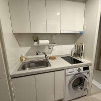 Kitchen area + laundry machine