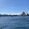 A picture of the Sydney Opera House and the surrounding city from the ferry.