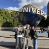 Me and two friends in front of the iconic Universal Globe on a sunny day