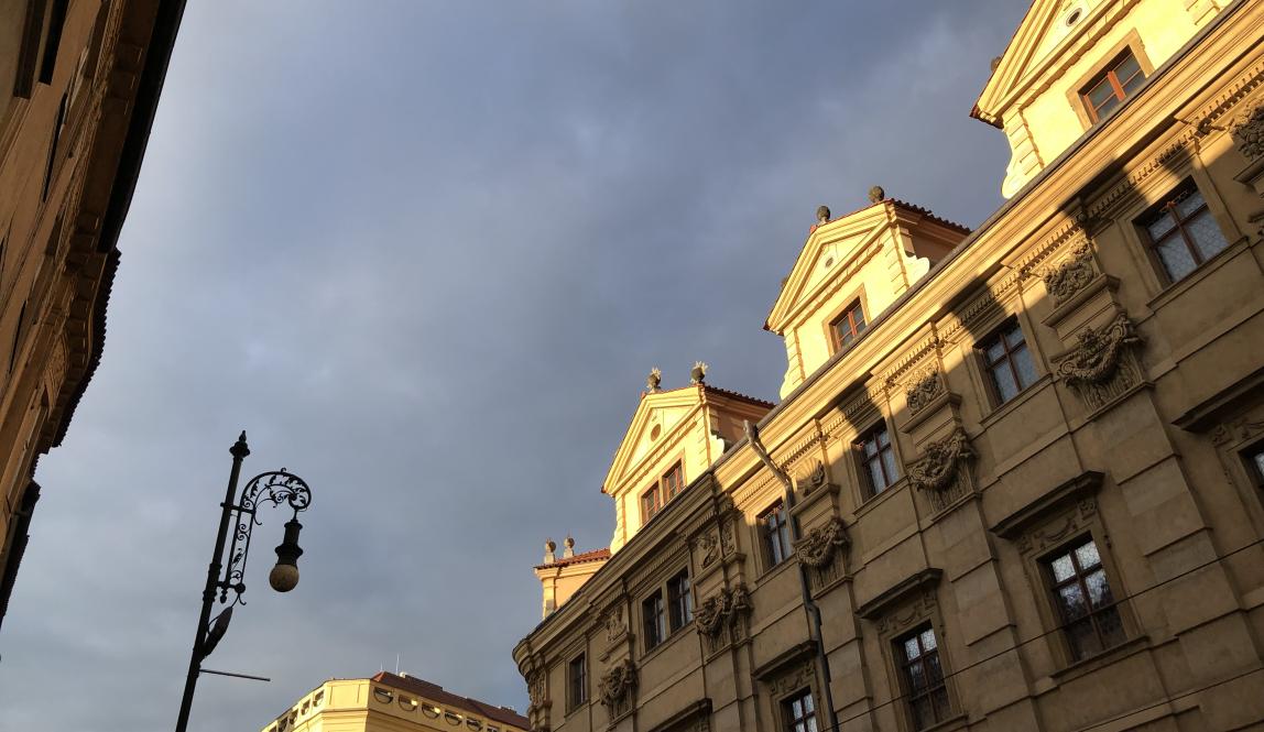 Buildings in evening light with old street lamp