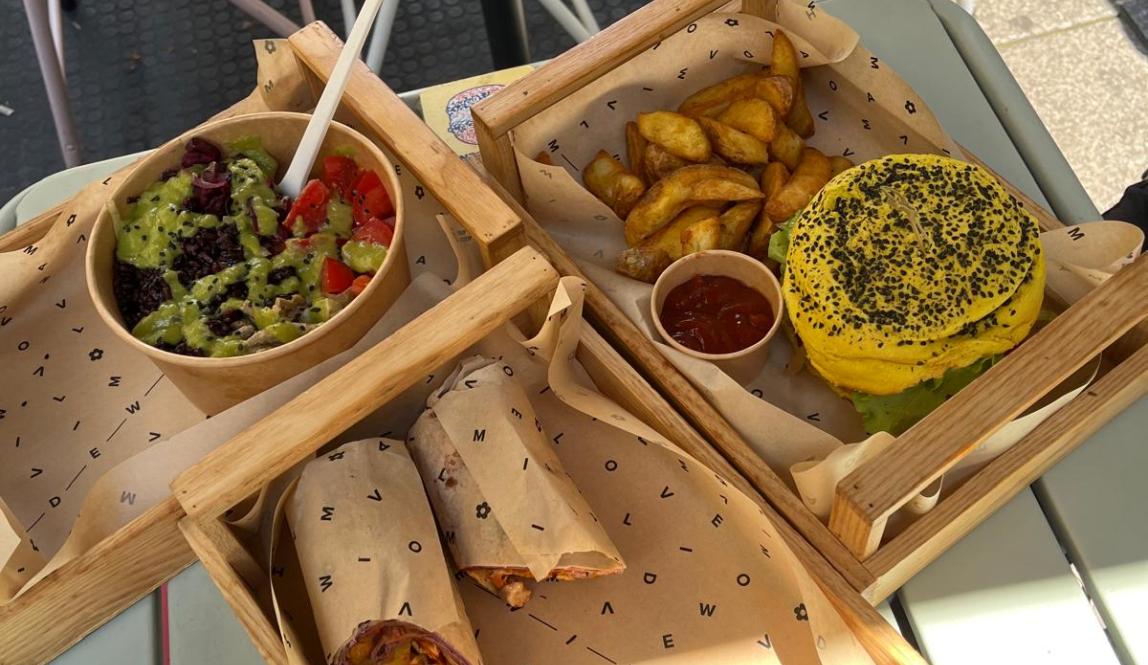 3 meals from Flower Burger: a wrap, a bowl, and a burger