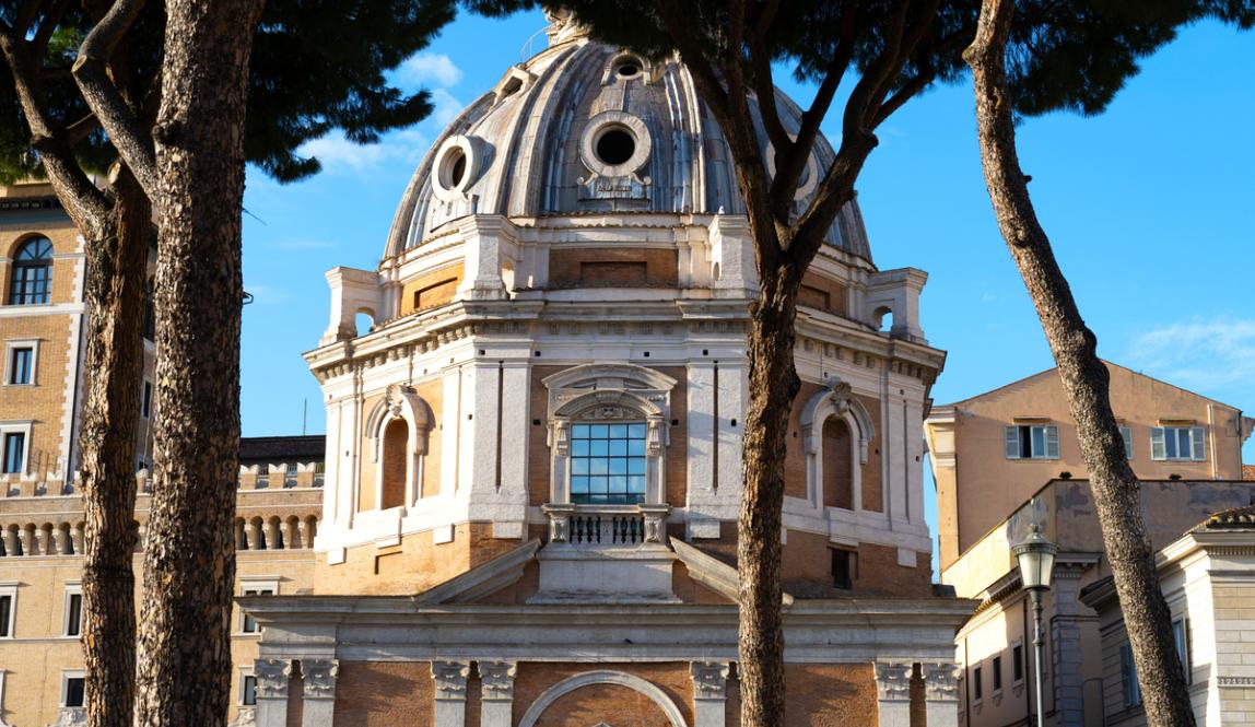A street view of the IES Abroad Rome Center, an ornate building with large windows and a domed roof.