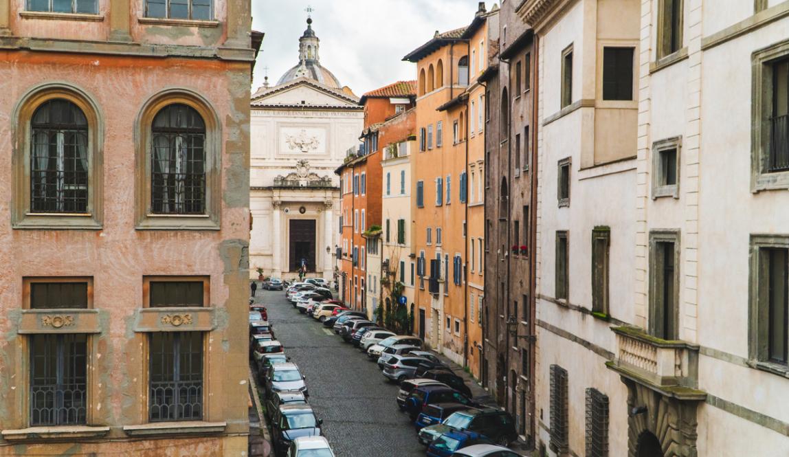 A view down a classic looking Roman street with stunning architecture, a view from the IES Rome Center.