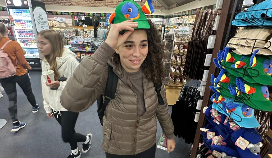 Me putting on a goofy hat my friends and I found at the Blue Mountains' gift shop.