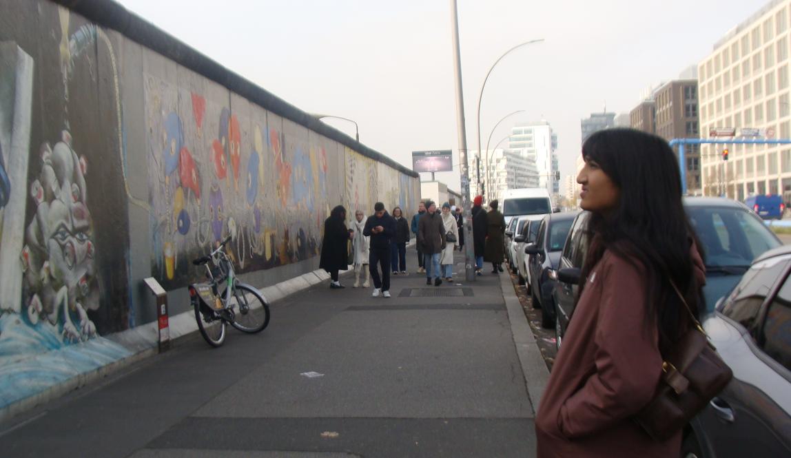 My roommate looking at the Berlin Wall