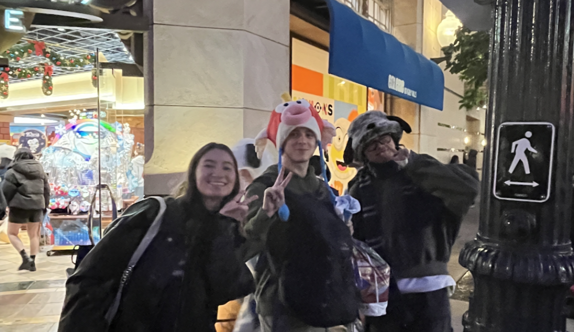 Me and two friends in front of the Universal Studios store