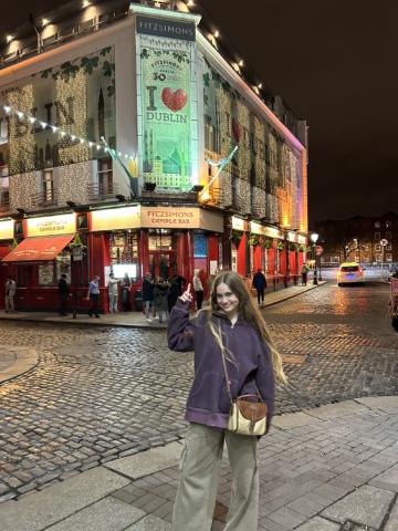 Posing under a sign that says I <3 Dublin