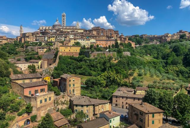 A view of the Tuscan hills in Siena on a sunny day.