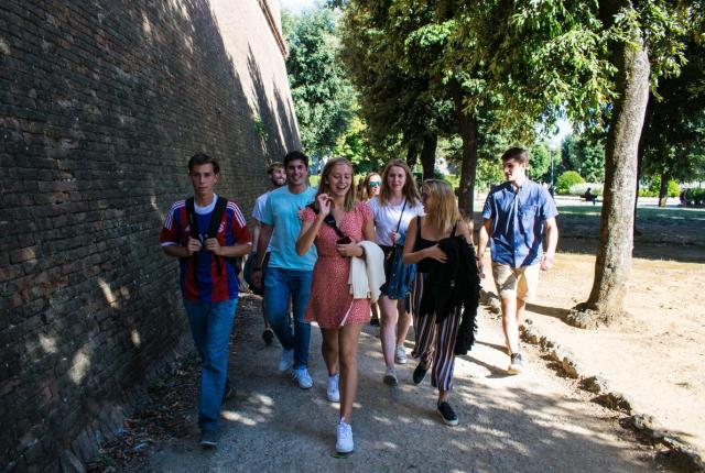 Students Walking down a street in Siena.