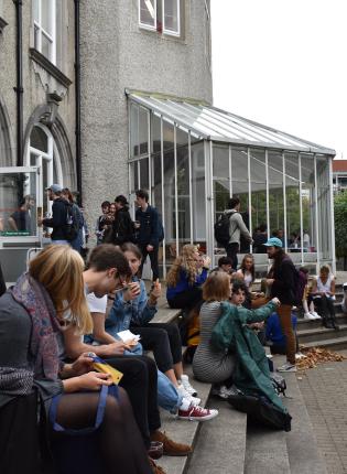 dublin students sitting outside the architecture building at University College Dublin