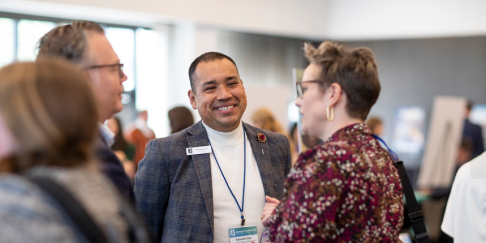 Colleagues talking at Annual Conference 